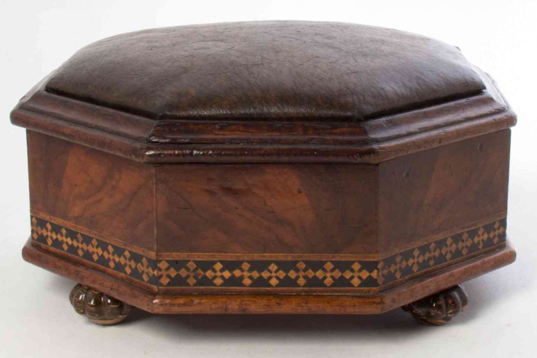A Tunbridge Style Marquetry Footstool, Diameter 11 1/2: A Tunbridge Style Marquetry Footstool, having a leather-inset lid opening to a vacant interior. Diameter 11 1/2 inches. Property from the Estate of Alice Lynne McKee, London, England and Lake Forest, 
