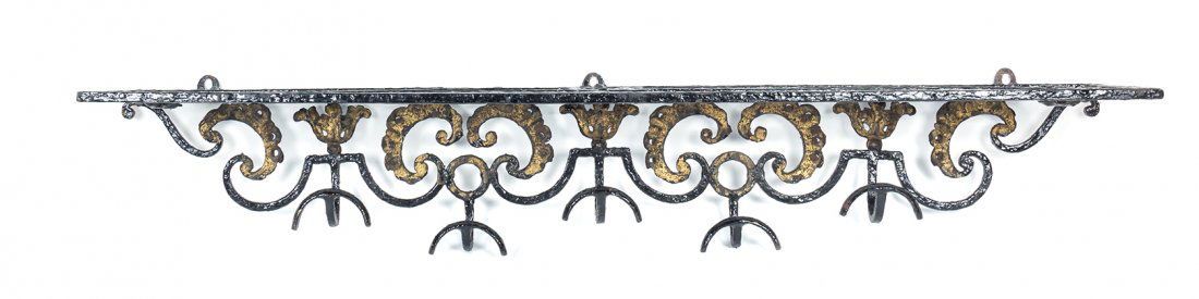 A Victorian Wrought Iron Coat Rack, Width 51 1/4: A Victorian Wrought Iron Coat Rack, having a rectangular top over the scrolling back set with S hooks. Width 51 1/4 inches.