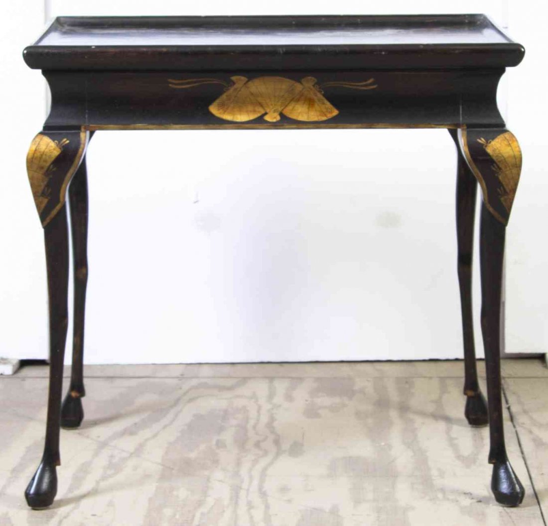 A Japanese Export Style Lacquered Tea Table, Height 26: A Japanese Export Style Lacquered Tea Table, LATE 20TH CENTURY, the rectangular top with gilt decoration, raised on cabriole legs. Height 26 1/2 x width 28 x depth 20 1/2 inches. Property from a Priva