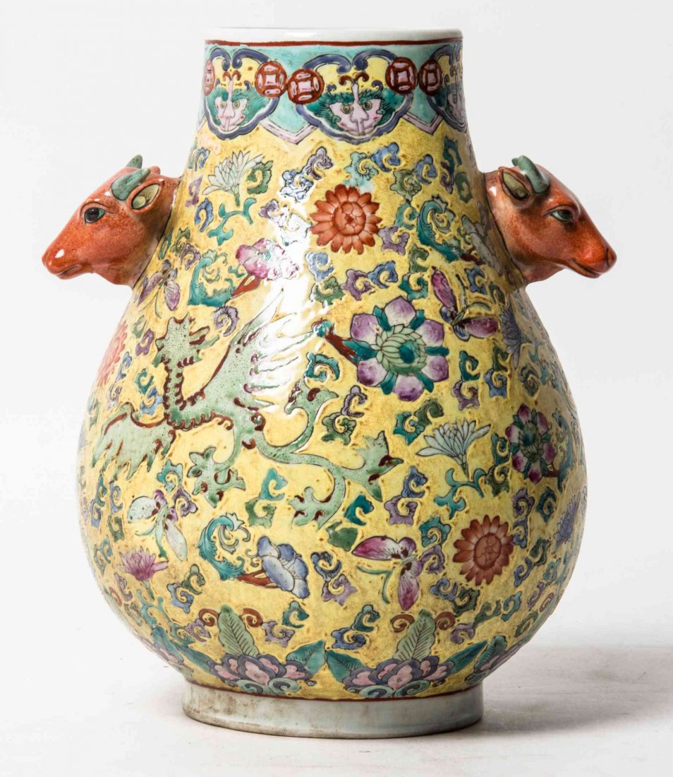 A Polychrome Enamel Porcelain Vase, Height 11 1/8: A Polychrome Enamel Porcelain Vase, with ox form handles. Height 11 1/8 inches. Property from a Midwest Corporate Collection