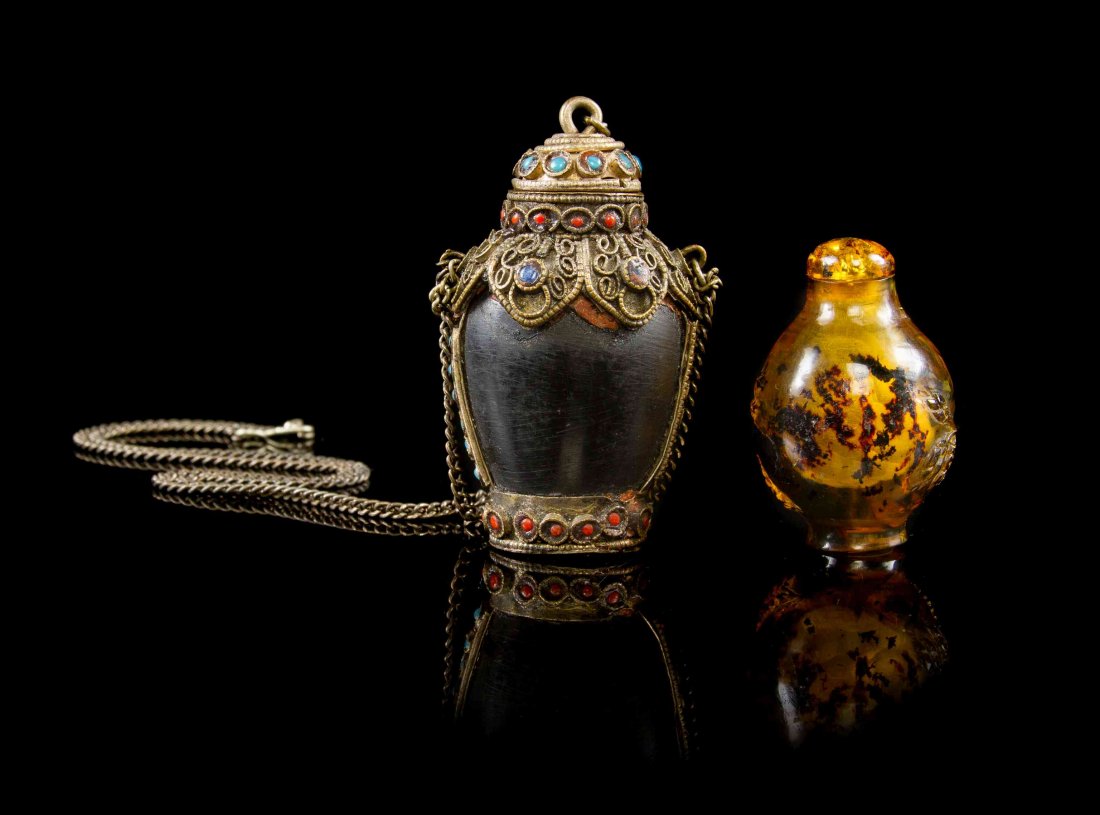 A Tibetan Metal Mounted Horn Snuff Bottle, Height 2 1/4: A Tibetan Metal Mounted Horn Snuff Bottle, together with a tortoiseshell example. Height 2 1/4 inches. Property from the Collection of James S. Frankenberger, Downers Grove, Illinois