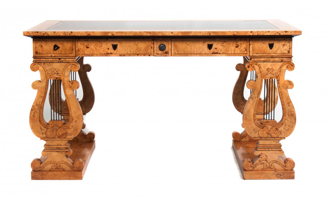 A Biedermeier Style Maple Bureau Plat, Height 30 3/4 x: A Biedermeier Style Maple Bureau Plat, having a rectangular leather inset top over four drawers raised on lyre form supports. Height 30 3/4 x width 55 1/4 x depth 29 inches. Property from the Collecti