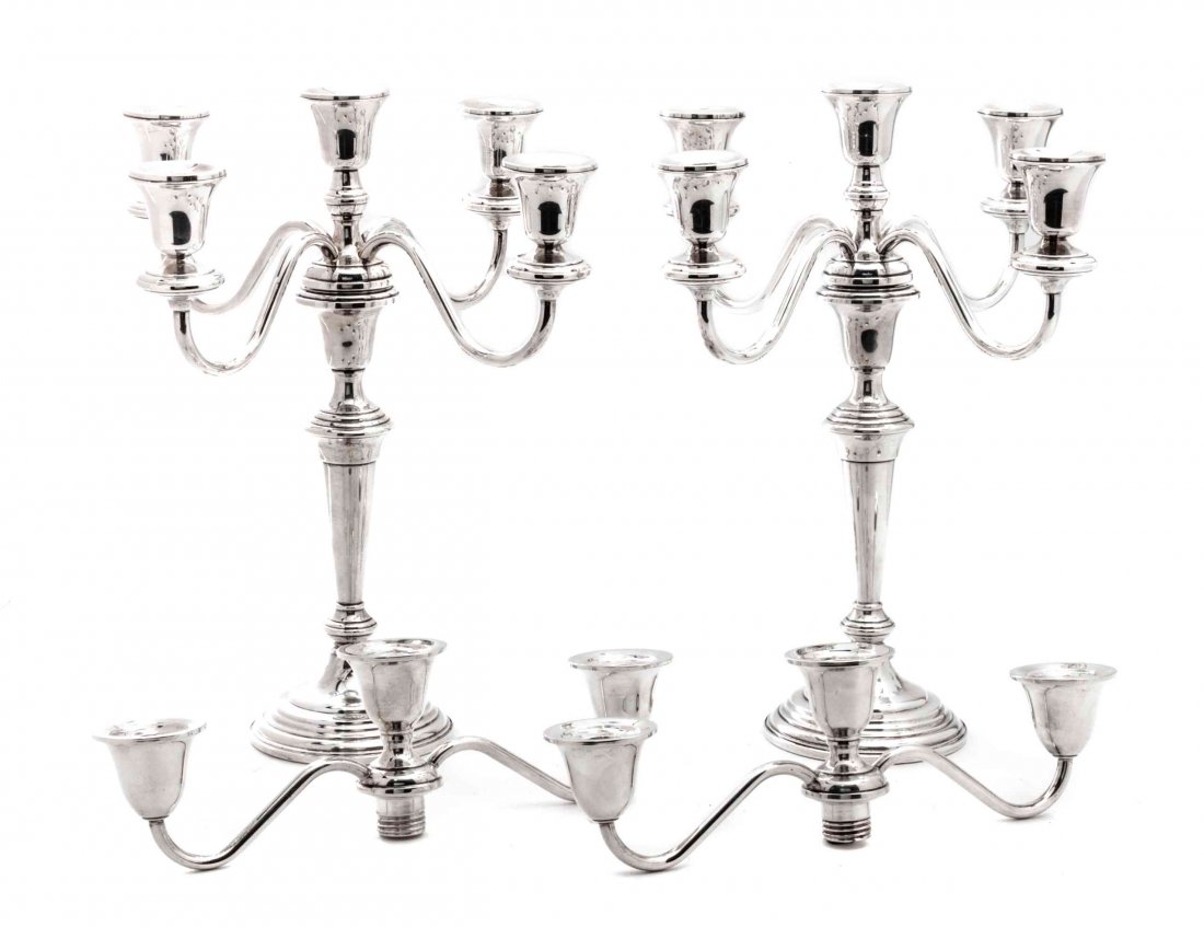 A Pair of American Silver Candelabras, Frank M. Whiting: A Pair of American Silver Candelabras, Frank M. Whiting Company, with tapered stems on circular bases, each with four scrolling branches, weighted, together with two associated American silver candela