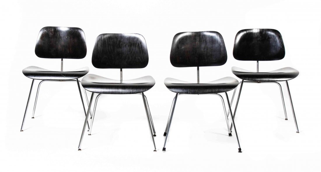 Four American Ebonized Wood DCM Chairs, Charles and Ray: Four American Ebonized Wood DCM Chairs, Charles and Ray Eames for Herman Miller, each having a laminated wood back and seat, raised on four metal legs. Height 30 1/2 inches. Property from the Estate o