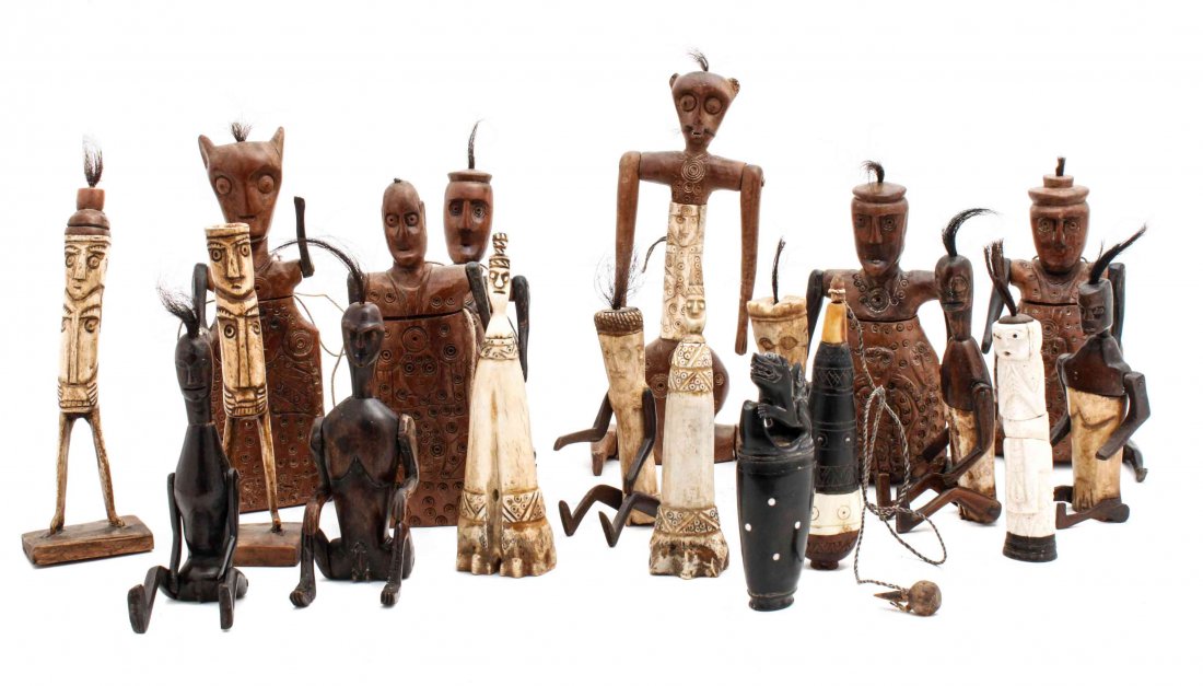 A Collection of Indonesian Carved Wood and Bone: A Collection of Indonesian Carved Wood and Bone Bottles, comprising examples of Lombok style medicine bottles and Sulewisi carved articles, 19 items total. Height of tallest 10 inches. Property from t