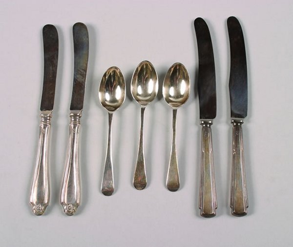 Two Cased Sets of Silver Butter Knives, Sheffield,: 1922 and 1931, one containing five knives, the other four, together with a cased set of silver plate utensils; eighteen pieces.