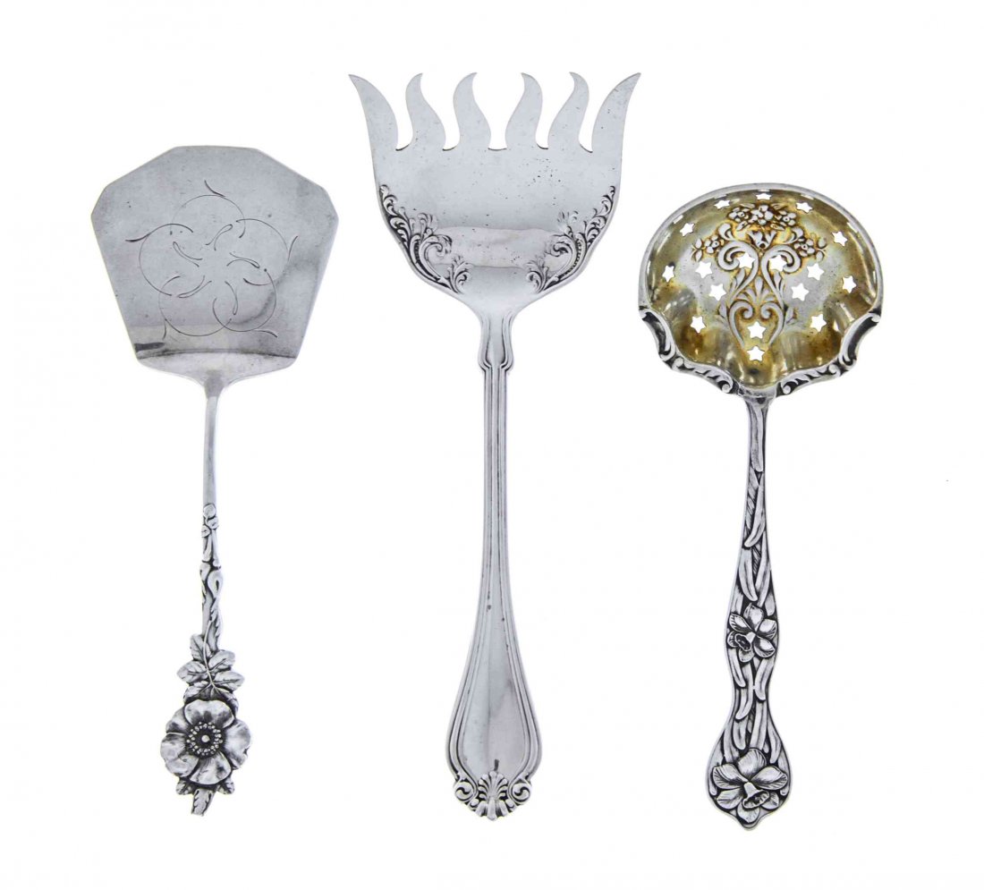 Three American Silver Servers, Early 20th Century,: Three American Silver Servers Early 20th Century comprising 1 cucumber server, Harlequin pattern, Reed & Barton, Taunton, MA 1 parcel-gilt sugar spoon, bowl chased with flowers and scrolls and pierced