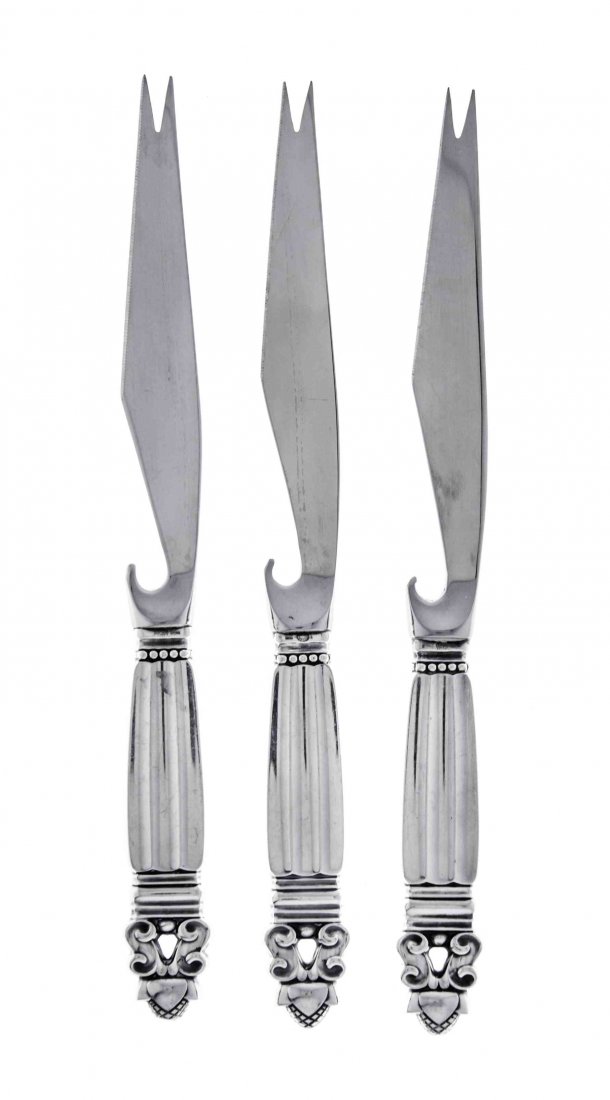 A Set of Three Danish Silver Bar Knives, Georg Jensen: A Set of Three Danish Silver Bar Knives Georg Jensen Silversmithy, Copenhagen, 1945-77 Acorn pattern, with silver handles and stainless steel blades Length 8 1/4 inches Condition: handles with light s