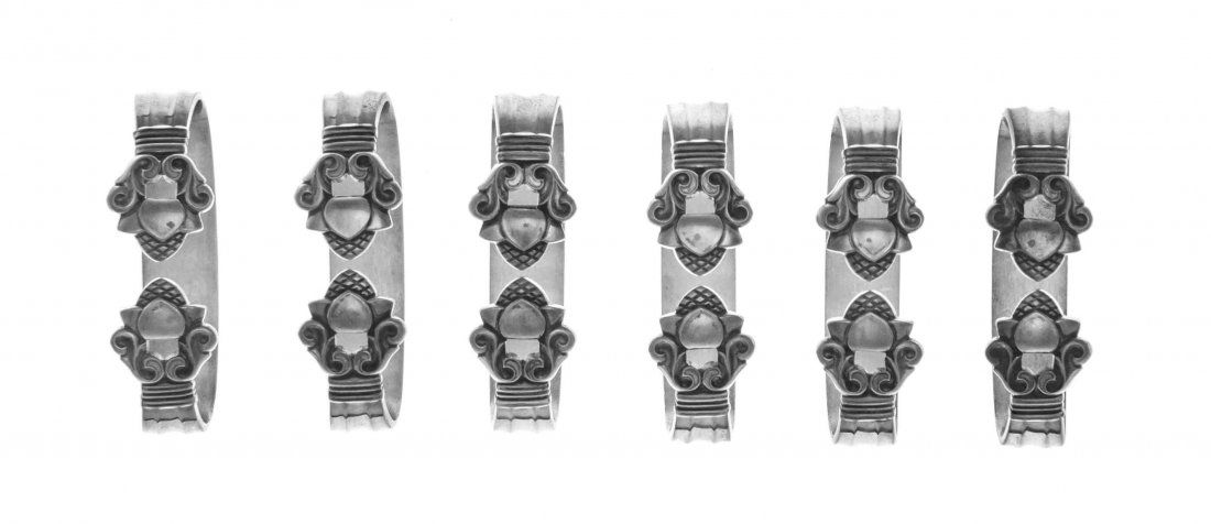 A Set of Six Danish Silver Napkin Rings, Georg Jensen,: A Set of Six Danish Silver Napkin Rings Georg Jensen, Copenhagen, 1945-77 Acorn pattern 5 ozt 4 dwt Length 2 1/8 inches Property from the Collection of Herb and Roberta Nechin, Chicago, Illinois
