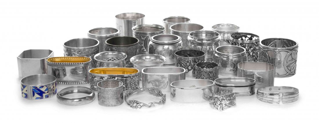 An Assembled Group of Sixty Napkin Rings, Various: An Assembled Group of Sixty Napkin Rings Various Makers, 20th Century comprising English, Danish, American and Continental examples, all different patterns and styles, together with 2 silver-plate exa