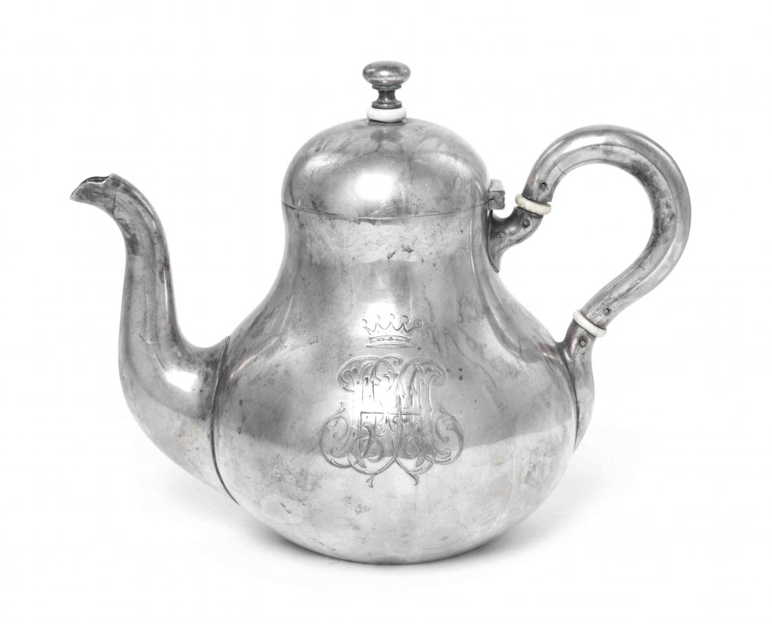 A Russian Silver Teapot, Garvil Grachev, St.: A Russian Silver Teapot Garvil Grachev, St. Petersburg, 1887 of baluster form with loop handle and scroll spout, engraved on one side with foliage monogram RRAH under a coronet marked on base and flan