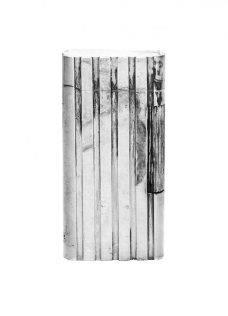 An American Silver Lighter, Tiffany & Co., New York,: An American Silver Lighter Tiffany & Co., New York, Mid 20th Century with flattened gadrooned body and hinged cover marked on flange Height 2 5/8 inches