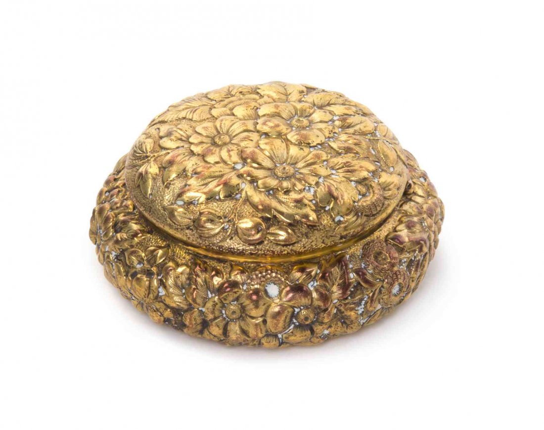 An American Silver-Gilt Pill Box, JE Caldwell,: An American Silver-Gilt Pill Box JE Caldwell, Philadelphia, Early 20th Century circular, the body and hinged cover engraved overall with dense flowers and foliage against a matted ground marked on bas