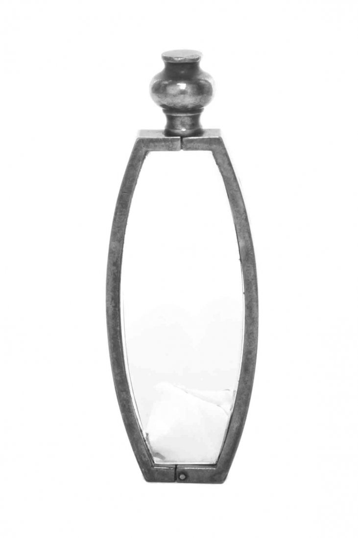 A French Silver-Mounted Magnifying Glass, Hermes,: A French Silver-Mounted Magnifying Glass Hermes, Paris, 20th Century ovoid form with frame and baluster handle, chip to glass marked on border Length 3 1/2 inches Property from the Estate of Anastasia
