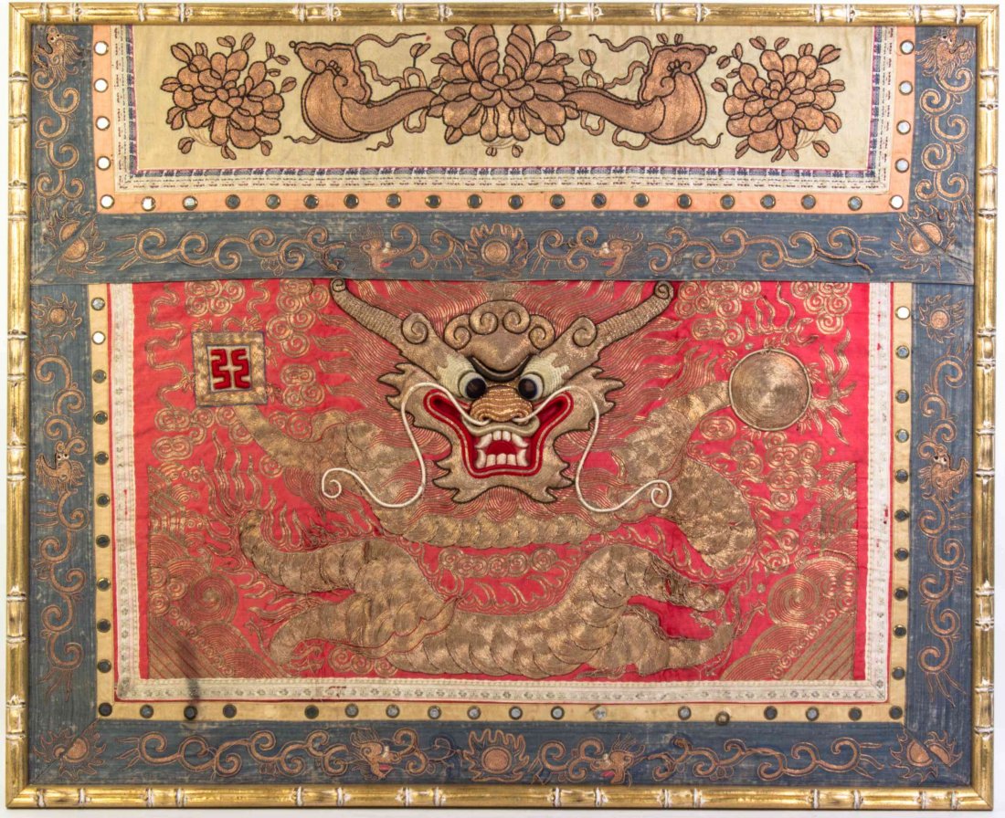 A Chinese Embroidered Silk Altar Frontal Height 33 1/4: A Chinese Embroidered Silk Altar Frontal depicting a forward facing dragon amidst clouds, the upper panel with foliate and lingzhi decoration, with gilt wrapped threads and sequins, framed. Height 33 