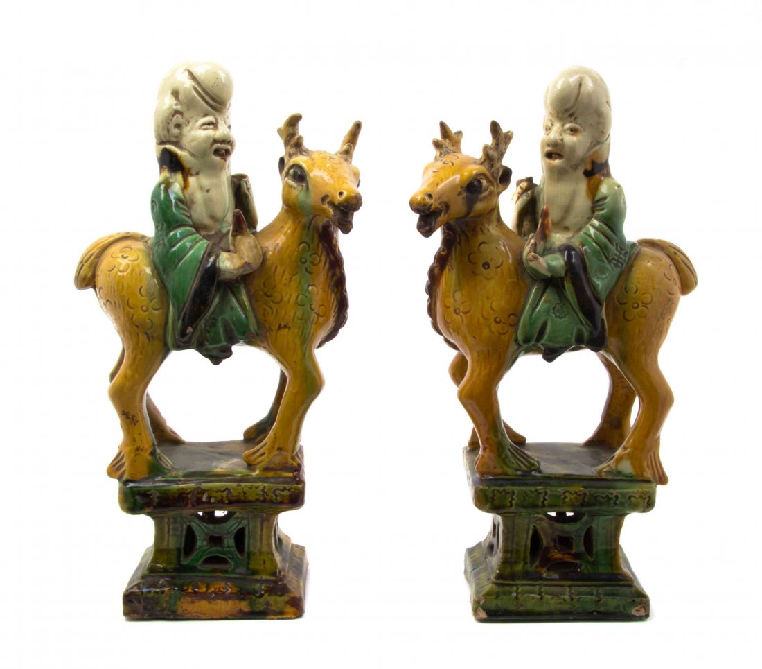 Two Pairs of Tang Style Figural Groups Height of: Two Pairs of Tang Style Figural Groups one pair depicting figures riding elephants, the other pair depicting Shoulao riding deer. Height of tallest 6 1/2 inches. Property from the Estate of James J. M