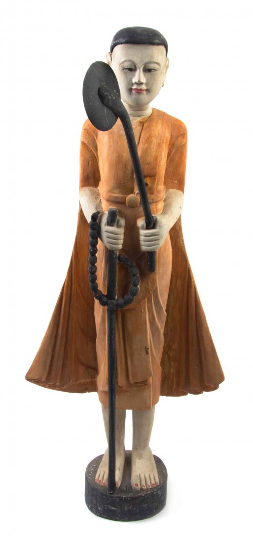 A Southeast Asian Polychrome Decorated Figure Height 33: A Southeast Asian Polychrome Decorated Figure depicted standing, holding a strand of mala and an attribute. Height 33 2/3 inches. Property from the Estate of James J. McKiernan, Kansas City, Missouri