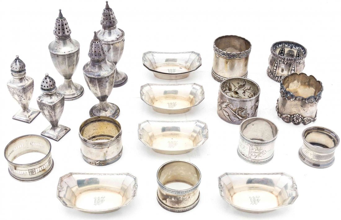 A Collection of American Silver and Silver-Plate Table: A Collection of American Silver and Silver-Plate Table Articles comprising six nut dishes, nine napkin rings and five casters Length of nut dishes 3 1/8 inches Property from the Estate of a Chicago Ar