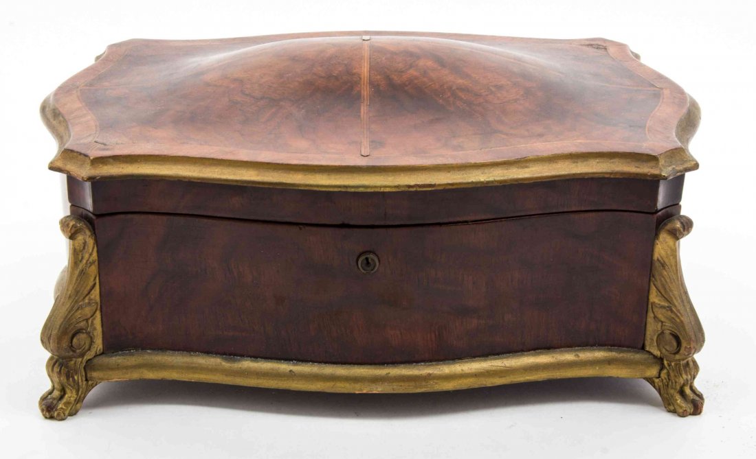 A Parcel Gilt Burlwood Jewelry Casket Width 13 5/8: A Parcel Gilt Burlwood Jewelry Casket 20TH CENTURY with a fitted interior. Width 13 5/8 inches.