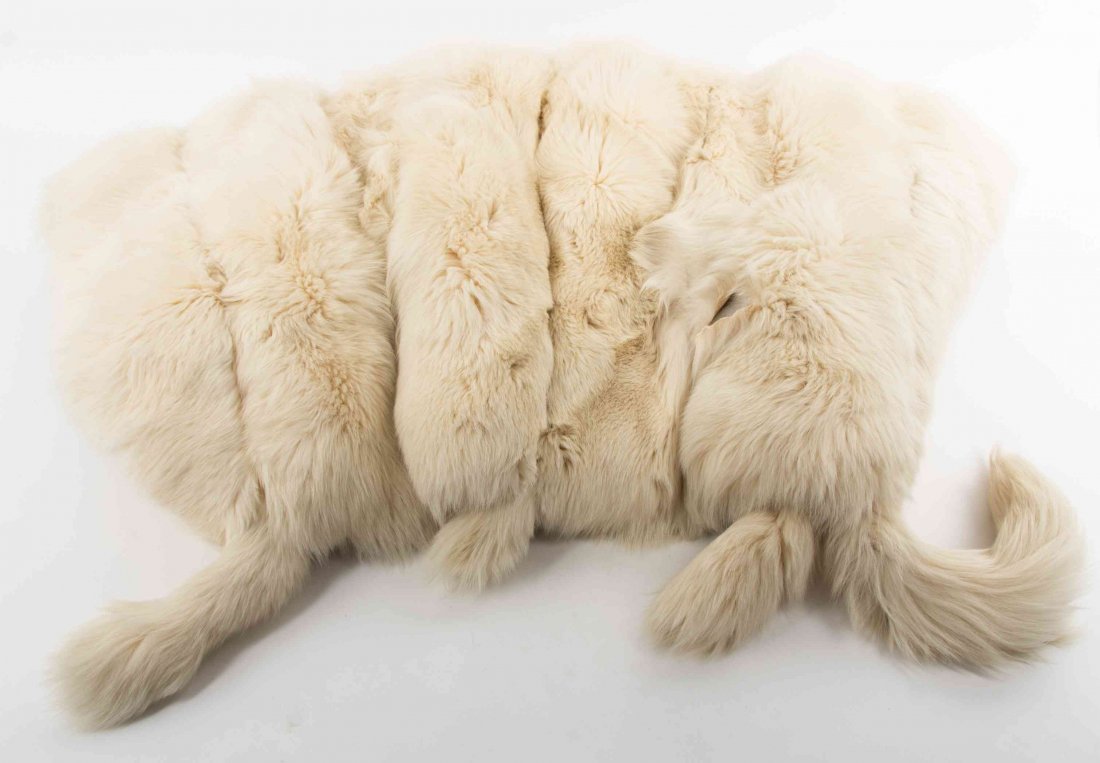 A Fox Fur Throw Height 67 x width 42 inches.: A Fox Fur Throw mounted to cotton velvet. Height 67 x width 42 inches. Condition: Several small tears noted.