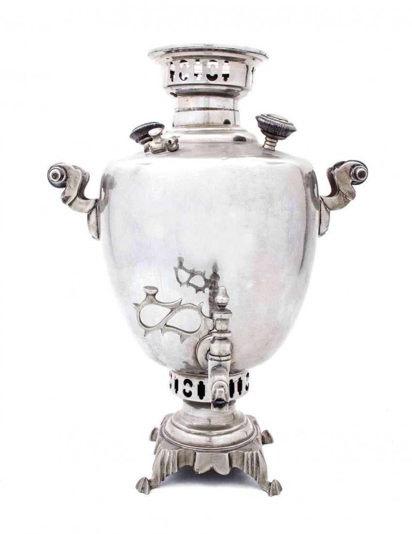 A Silvered Metal Samovar Height of first 15 1/4 inches.: A Silvered Metal Samovar together with an oval serving tray. Height of first 15 1/4 inches. Condition: Overall good condition. Surface scratches, dull patina and a few small dents. No lid. Tray with s