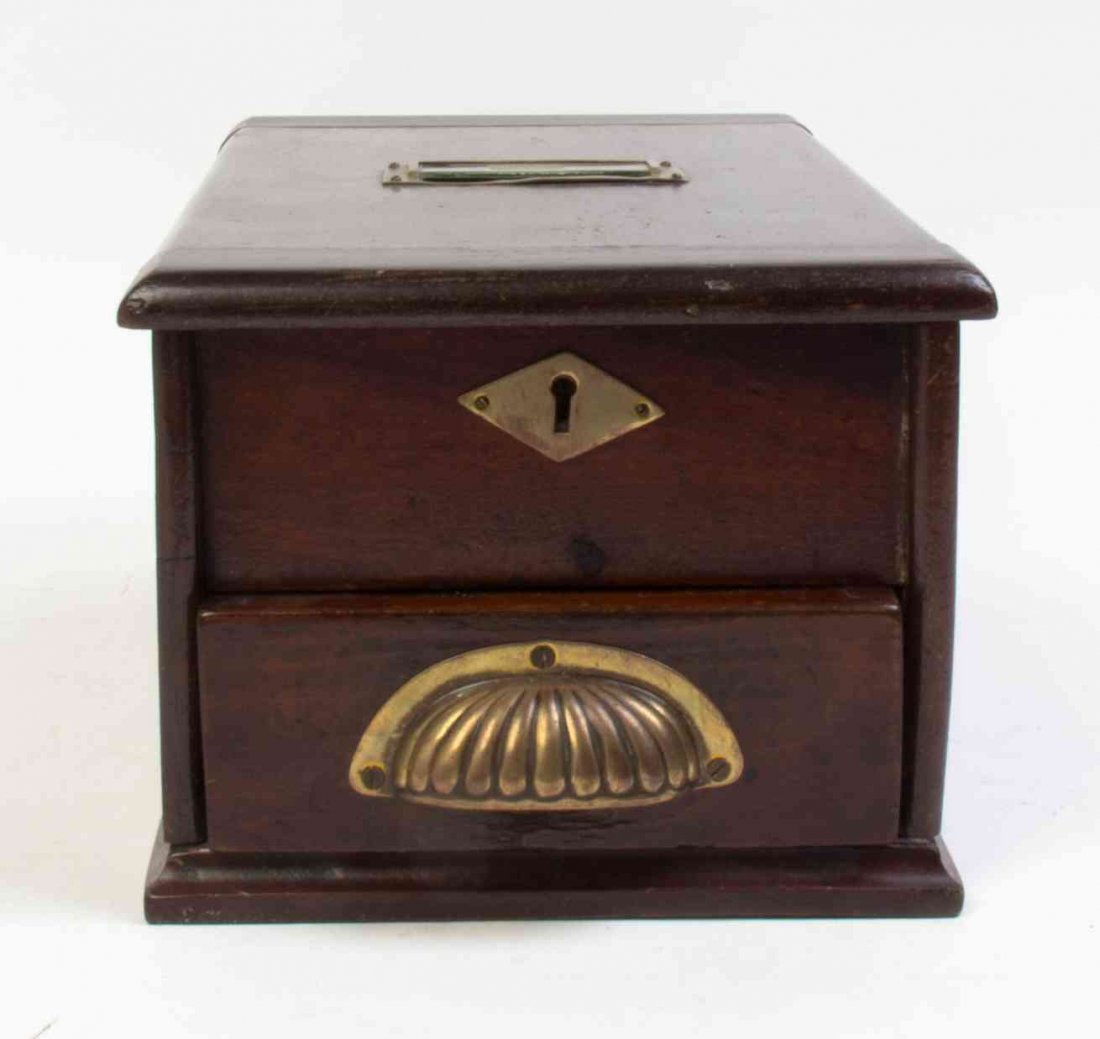 An English Mahogany Cash Till Height 6 1/2 x width 8 x: An English Mahogany Cash Till with a brass handle and escutcheon. Height 6 1/2 x width 8 x depth 15 1/2 inches. Property from the Estate of Alice Lynne McKee, London, England and Lake Forest, Illinois