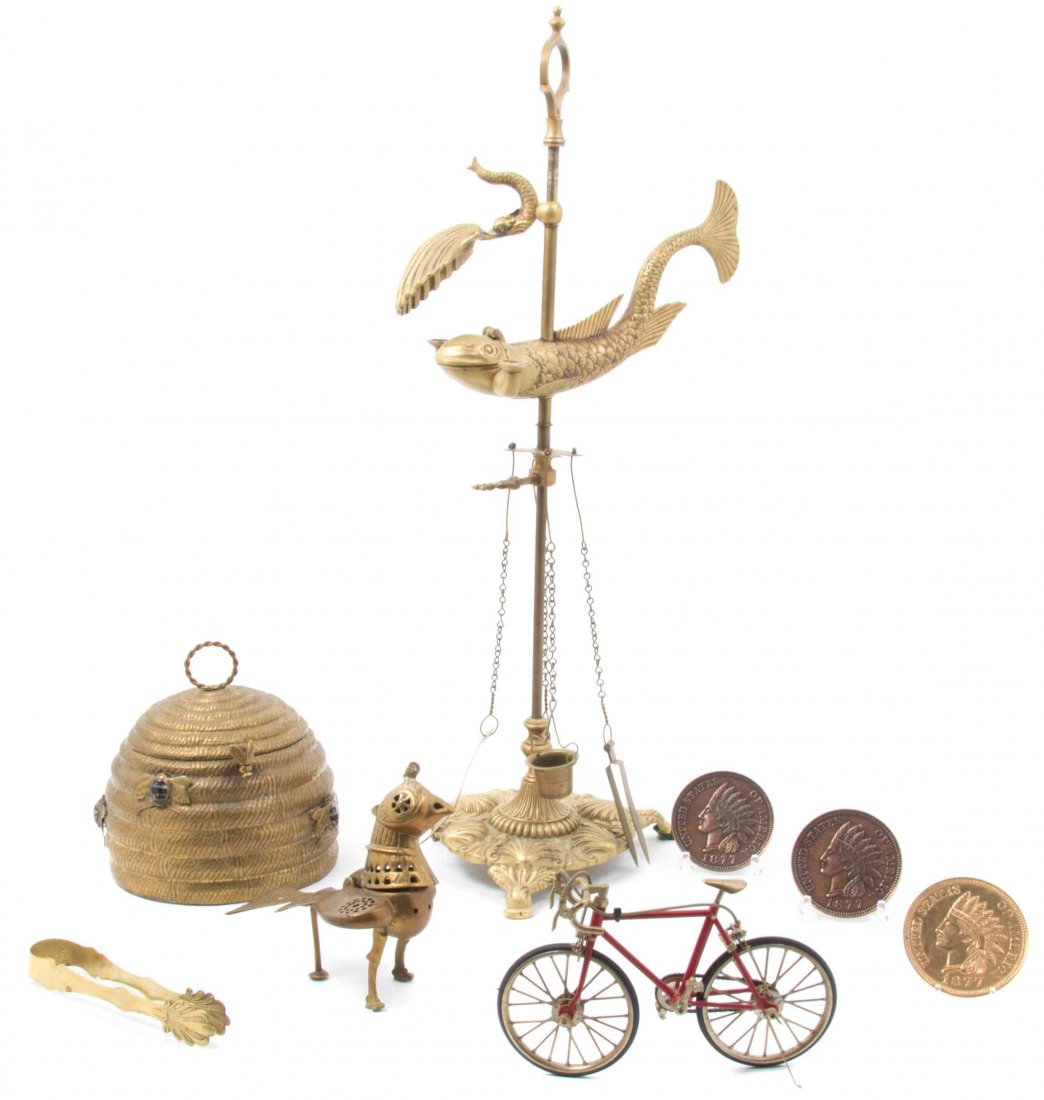 A Collection of Cast Metal Decorative Articles Height: A Collection of Cast Metal Decorative Articles comprising a beehive form box, a bird form censer and five others. Height 24 1/4 inches. Property from the Estate of James J. McKiernan, Kansas City, Mis