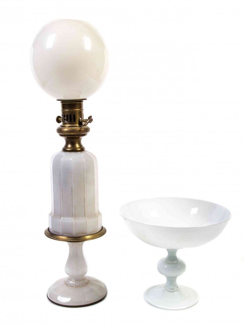 An Opaline Glass Fluid Lamp Height of first overall 30: An Opaline Glass Fluid Lamp of faceted baluster form, together with a glass compote. Height of first overall 30 1/2 inches. Property from the Estate of James J. McKiernan, Kansas City, Missouri
