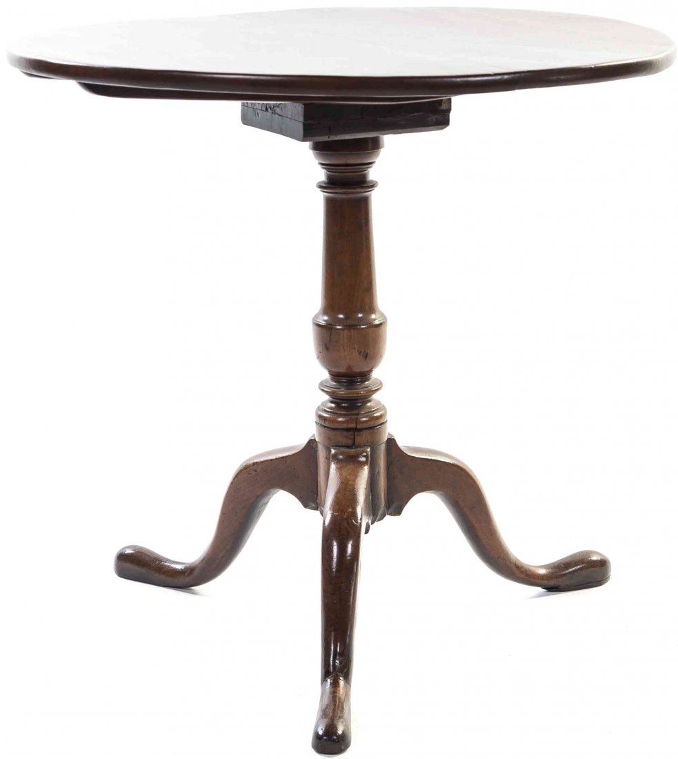 A George III Style Mahogany Tilt-Top Tea Table Height: A George III Style Mahogany Tilt-Top Tea Table having a circular top set on a turned standard and raised on a tripod base. Height 27 3/4 x diameter 30 1/4 inches. Property from the Estate of a Chicago