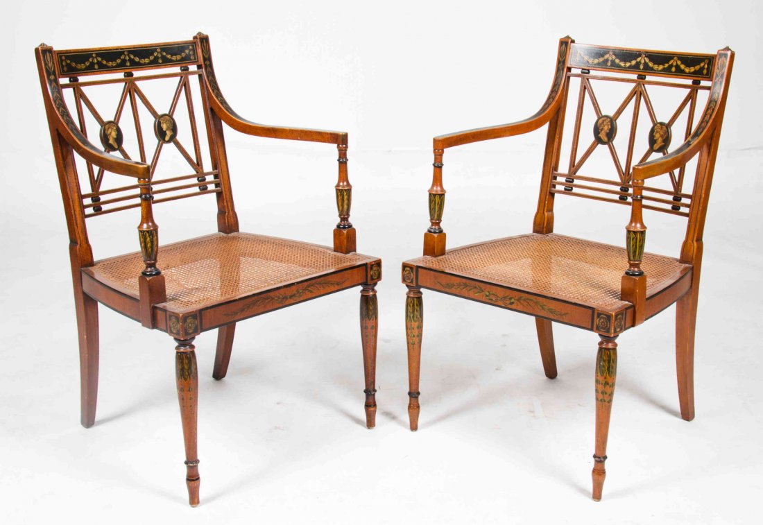 A Pair of Edwardian Style Open Armchairs Height 35 1/2: A Pair of Edwardian Style Open Armchairs JOHN COLBY & SONS, FIRST HALF 20TH CENTURY each having neoclassical profile and swag decoration over a caned seat. Height 35 1/2 inches.