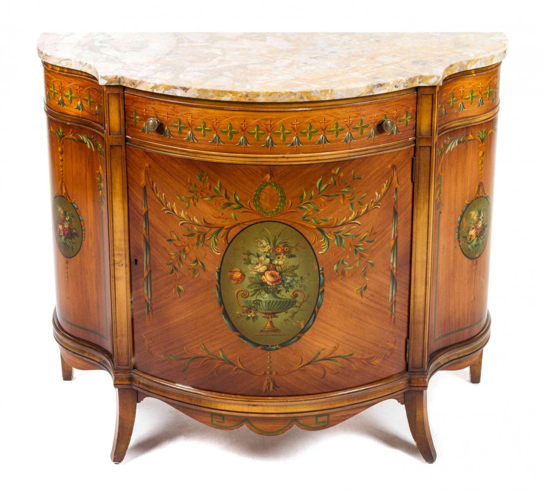 An Edwardian Style Console Cabinet Height 34 x width 40: An Edwardian Style Console Cabinet having a shaped marble top over a conforming case enclosing a long drawer and a cupboard, raised on square tapering legs, painted throughout to show Adam style decor