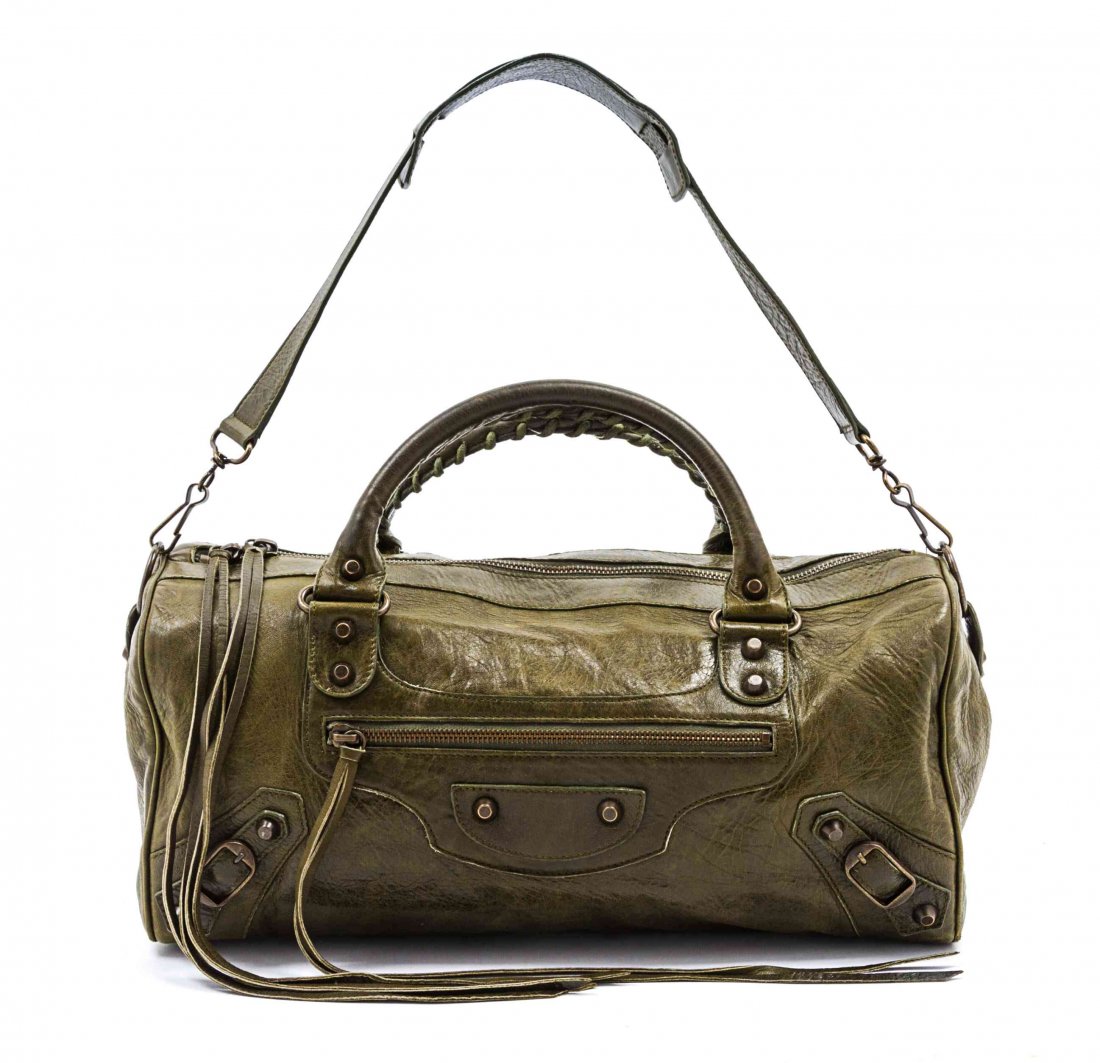 A Balenciaga Green Leather Motorcycle Bag, 17 x 7 x 5: A Balenciaga Green Leather Motorcycle Bag, detachable shoulder strap, two top handles, brass studs, zippered top closure with extra long leather pulls, exterior zippered pocket, interior zippered pock