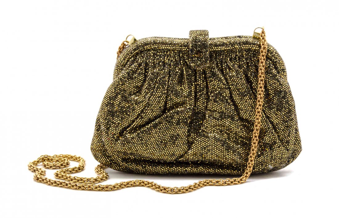 A Chanel Gold Glitter Evening Bag, 7 1/2 x 4 1/2 x 1: A Chanel Gold Glitter Evening Bag, with drop-in chain shoulder strap, foldover clasp with interlocking 'C' logo, goldtone hardware, gold lining, interior zippered pocket. Stamped: Chanel. 7 1/2 x 4 1/
