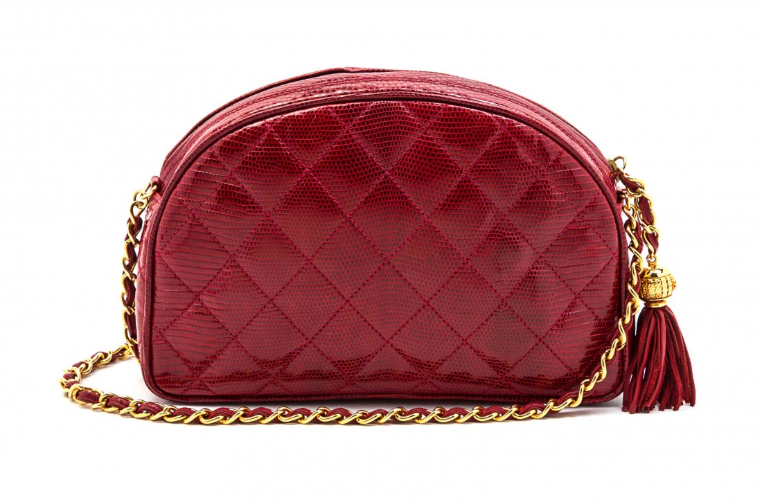 A Chanel Red Quilted Lizardskin Bag, 9 x 5 x 2 inches.: A Chanel Red Quilted Lizardskin Bag, circa 1987, zippered top closure with tassel and chain link pull, interwoven leather and chain link shoulder strap, zippered interior pocket, red leather lining. S
