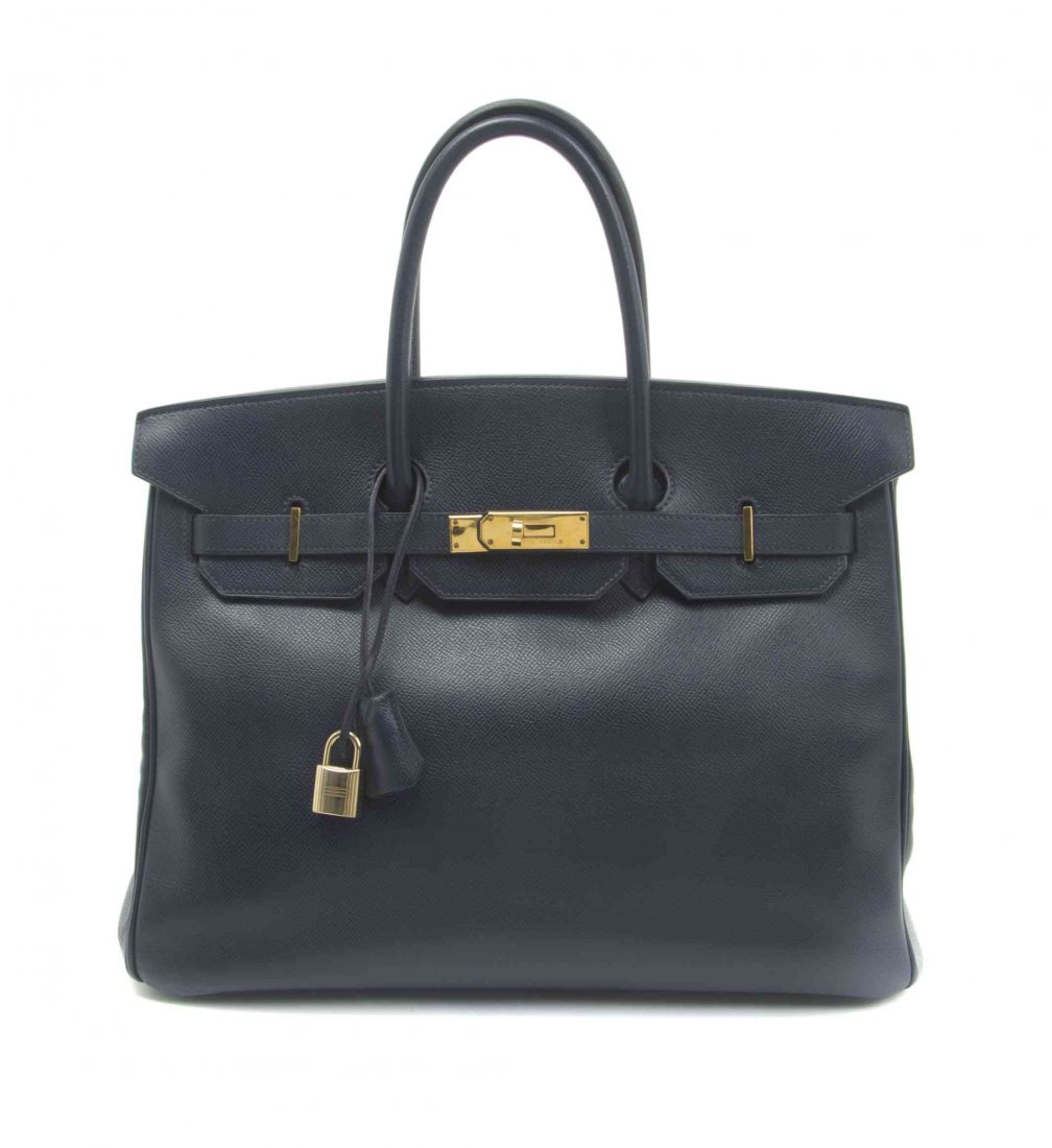 An Hermes 35cm Indigo Leather Birkin Bag, 14 x 10 x 7: An Hermes 35cm Indigo Leather Birkin Bag, 1997, gold hardware, lock and key sheath, blindstamp square A. Stamped: Hermes. 14 x 10 x 7 inches. Property from the Collection of a Lady, New York and Londo