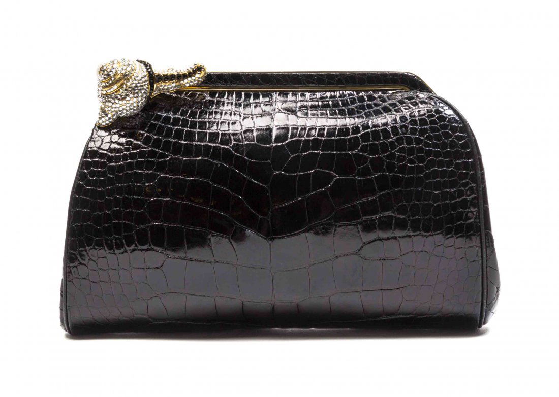 A Judith Leiber Black Alligator Evening Bag, 8 1/2 x 5: A Judith Leiber Black Alligator Evening Bag, goldtone frame, with a Swarovski rhinestone and faux pearl push-button clasp, drop-in alligator shoulder strap, interior slip and zippered pockets, leather