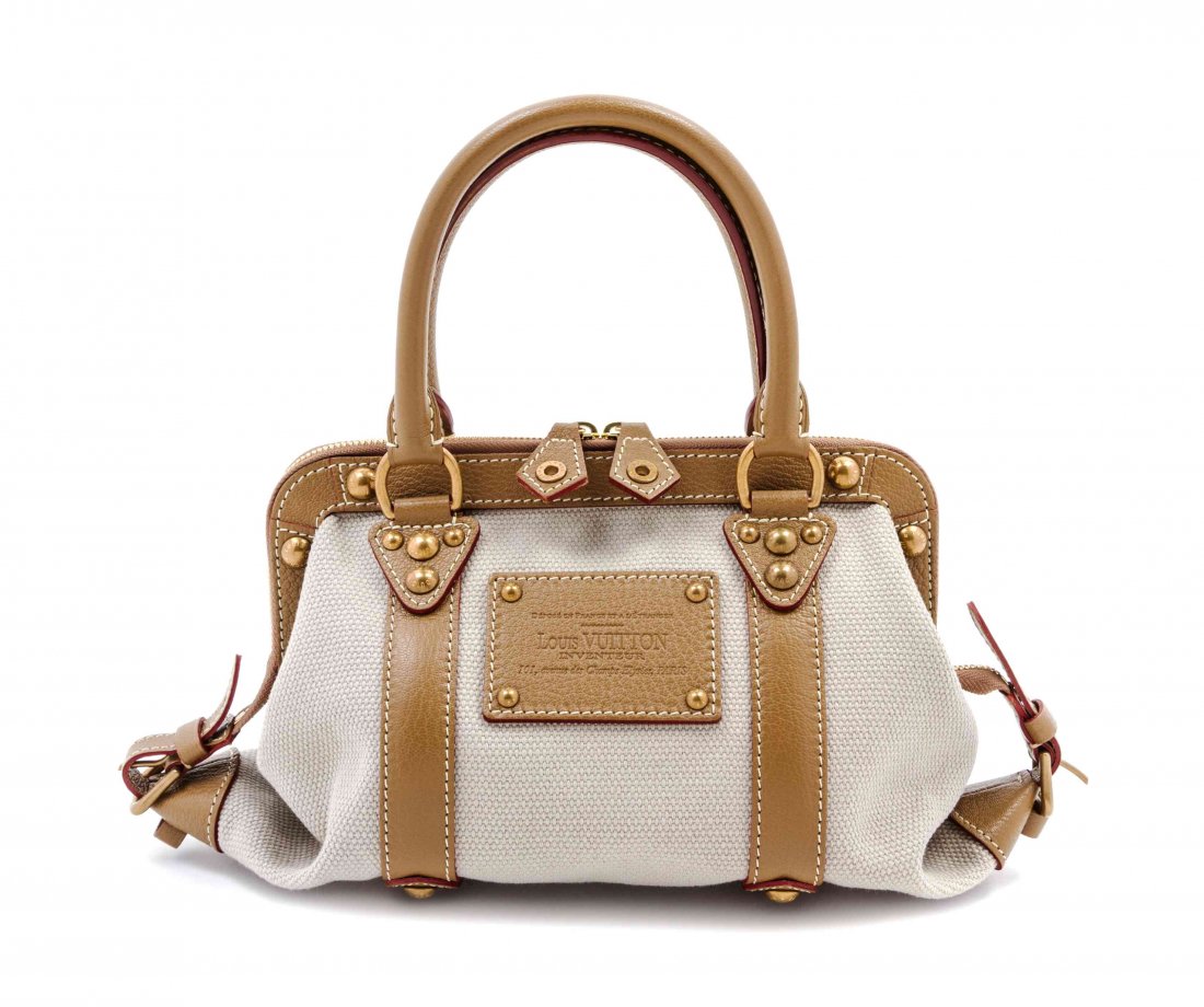 A Louis Vuitton Toile Trianon Canvas Leather Inventeur: A Louis Vuitton Toile Trianon Canvas Leather Inventeur Sac de Nuit Bag, brass hardware, two top handles, framed top with zippered top closure, interior slip pocket, striped cotton lining. Stamped: Lou