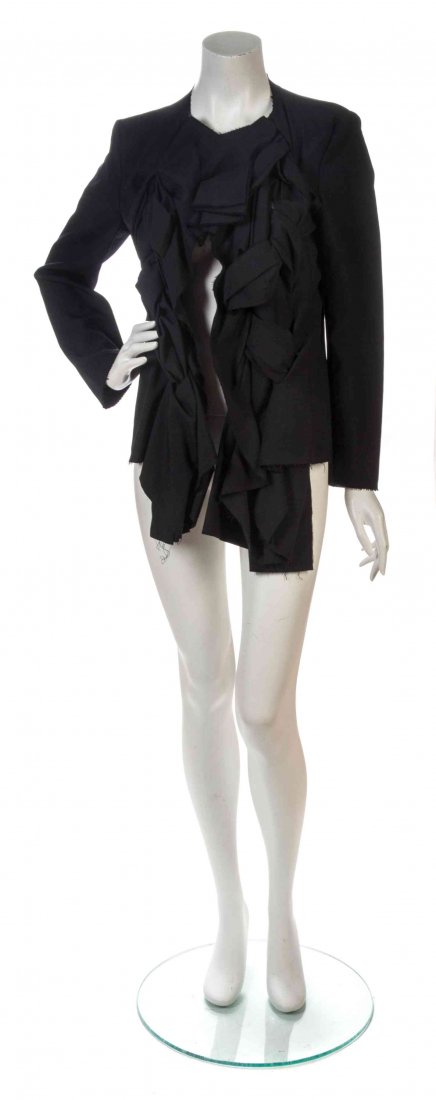 A Comme des Garcons Black Wool Knot Jacket, Size M.: A Comme des Garcons Black Wool Knot Jacket, Spring/Summer 2003. open front with knotted fabric to each panel, asymmetric hemline. Labeled: Comme des Garcons. Size M.