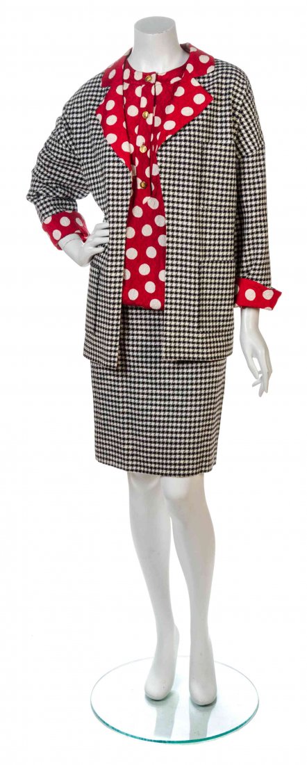 A Chanel Black and White Houndstooth Skirt Ensemble,: A Chanel Black and White Houndstooth Skirt Ensemble, comprised of an open front blazer with four patch pockets lined in a red and white polka dot matelasse silk print; together with a three quarter le