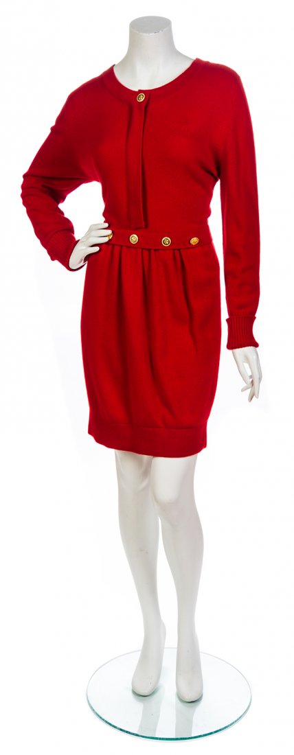 A Chanel Red Wool Knit Sweater Dress, Size 2.: A Chanel Red Wool Knit Sweater Dress, with decorative goldtone clover leaf buttons. Labeled: Chanel. Size 2. Property from the Estate of Rita Dee Hassenfeld, Palm Beach, Florida