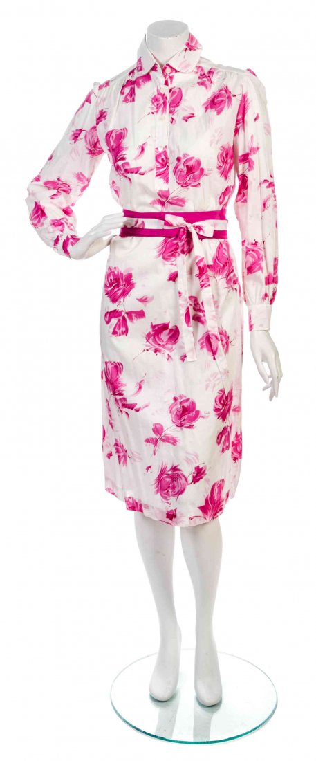 Two Emilio Pucci Cotton Print Dresses, Sizes 6 & 8.: Two Emilio Pucci Cotton Print Dresses, the first in a tunic style in a pink floral print with a self-belt and a pink belt, the second in a shirt dress style in a peach graphic print. Each labeled: Emi