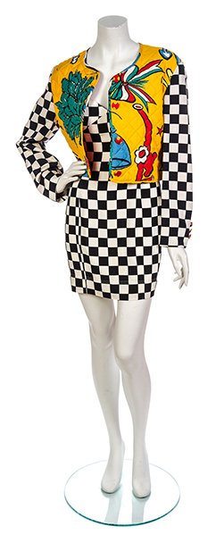 A Moschino 'Popeye' Dress Ensemble, Dress Size 6,: A Moschino 'Popeye' Dress Ensemble, 1989, quilted jacket with Popeye cartoon throughout, together with a fitted black and white check slip dress. Labeled: Moschino Pret-a-Porter. Dress Size 6, jacket