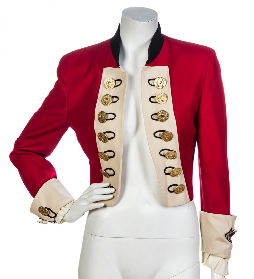 A Moschino Cheap and Chic Red Cropped Jacket,: A Moschino Cheap and Chic Red Cropped Jacket, 1980s, with an ivory contrast trim and oversized goldtone buttons. Labeled: Moschino Cheap and Chic. Condition: Measurements: Bust: 16 1/2" flat Overall f