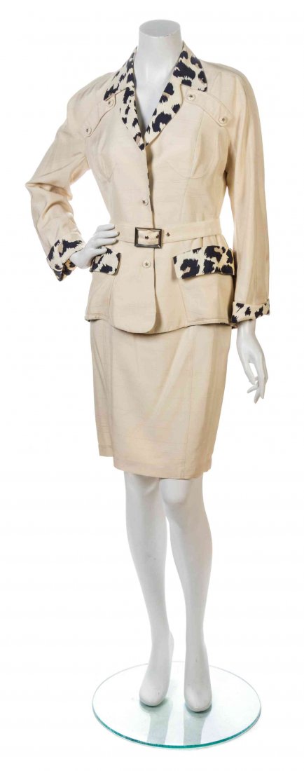 A Thierry Mugler Ivory Silk Skirt Ensemble, Size 40.: A Thierry Mugler Ivory Silk Skirt Ensemble, 1980s, comprised of a fitted jacket with a snap button down center, a contrast leopard print to the lapels, pockets and sleeve cuffs, and a detachable buckl