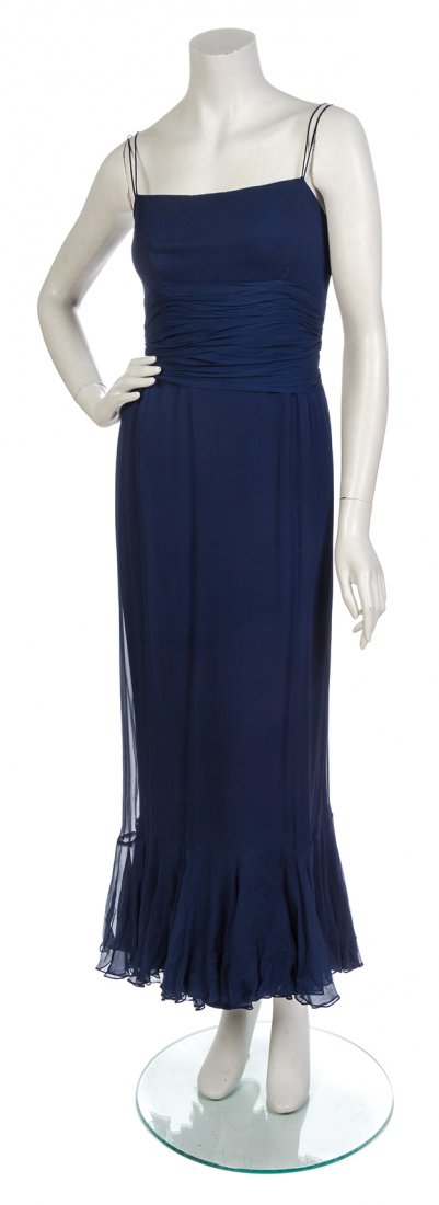 A Navy Chiffon Evening Dress,: A Navy Chiffon Evening Dress, camisole straps, with a gathered ruched waist and a cascading ruffle down the center back. Labeled: Marshall Field and Company. Condition: Measurements: Bust: 14 1/2" fla