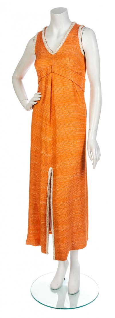 A Tangerine Woven Silk Couture Gown and Jacket: A Tangerine Woven Silk Couture Gown and Jacket Ensemble, comprised of an A-line gown with an ivory Passementerie trim and center front split hem, together with a snap button boxy jacket, fully lined.