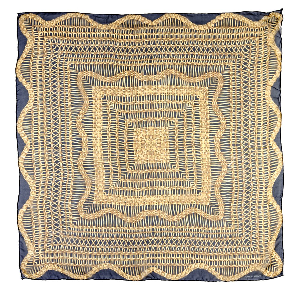 Two Giorgio Armani Silk Print Scarves,: Two Giorgio Armani Silk Print Scarves, the first in a black and gold silk chiffon, the second in silk with a grey and taupe abstract print. Each labeled: Giorgio Armani. Property from the Estate of Ri