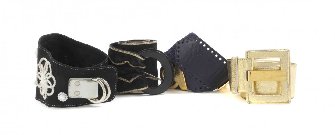 A Group of Four Yves Saint Laurent Belts,: A Group of Four Yves Saint Laurent Belts, comprised of a gold metallic leather belt, a black suede and gold trim belt, a navy leather and elastic belt with a goldtone buckle, and a black linen belt wi