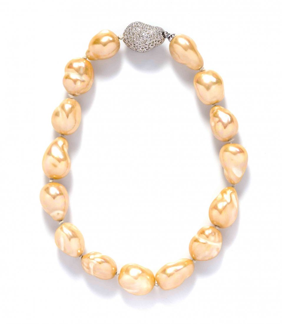 A Judith Leiber Faux Pearl Necklace,: A Judith Leiber Faux Pearl Necklace, with a pave rhinestone bead clasp. Stamped: Judith Leiber. Condition: Overall excellent condition. Includes dustbag and box.