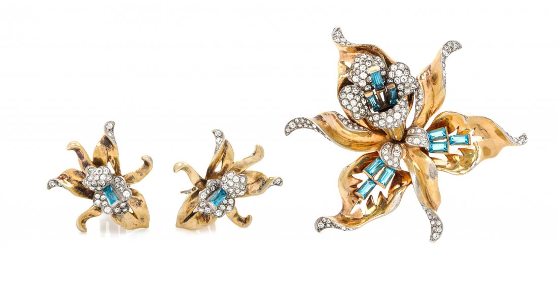 A Mazer Goldtone Sterling Floral Brooch and Earclips,: A Mazer Goldtone Sterling Floral Brooch and Earclips, each with blue bar crystals and pave rhinestones. Each stamped: Mazer. Property from a Private Collection